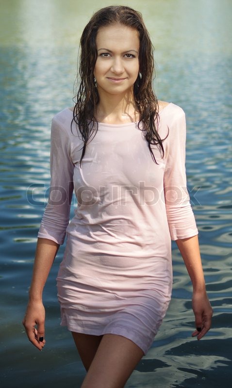Young beautiful woman in a wet dress | Stock image | Colourb