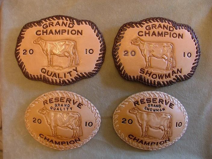 Hand Made Leather Trophy Belt Buckles by Deana's Designs .