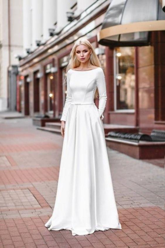 Relaxed A-line Satin Long-sleeved Wedding Dress with Pockets .