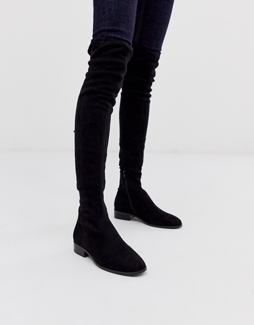 ASOS DESIGN Kayden flat thigh high boots in black | AS