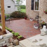 Charming Front Yard Patio with Boral Clay Pavers and Natural Stone .