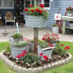 A Gathering of Mop Buckets in a Small Junk Garden | Easy garden .