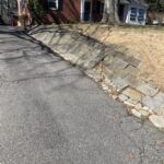 Looking for advice how to improve this driveway retaining wall and .