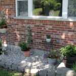 Ugly flower bed turned container rock gard