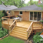 Wood deck with landscaping maintenance - DM Outdoor Living Spac